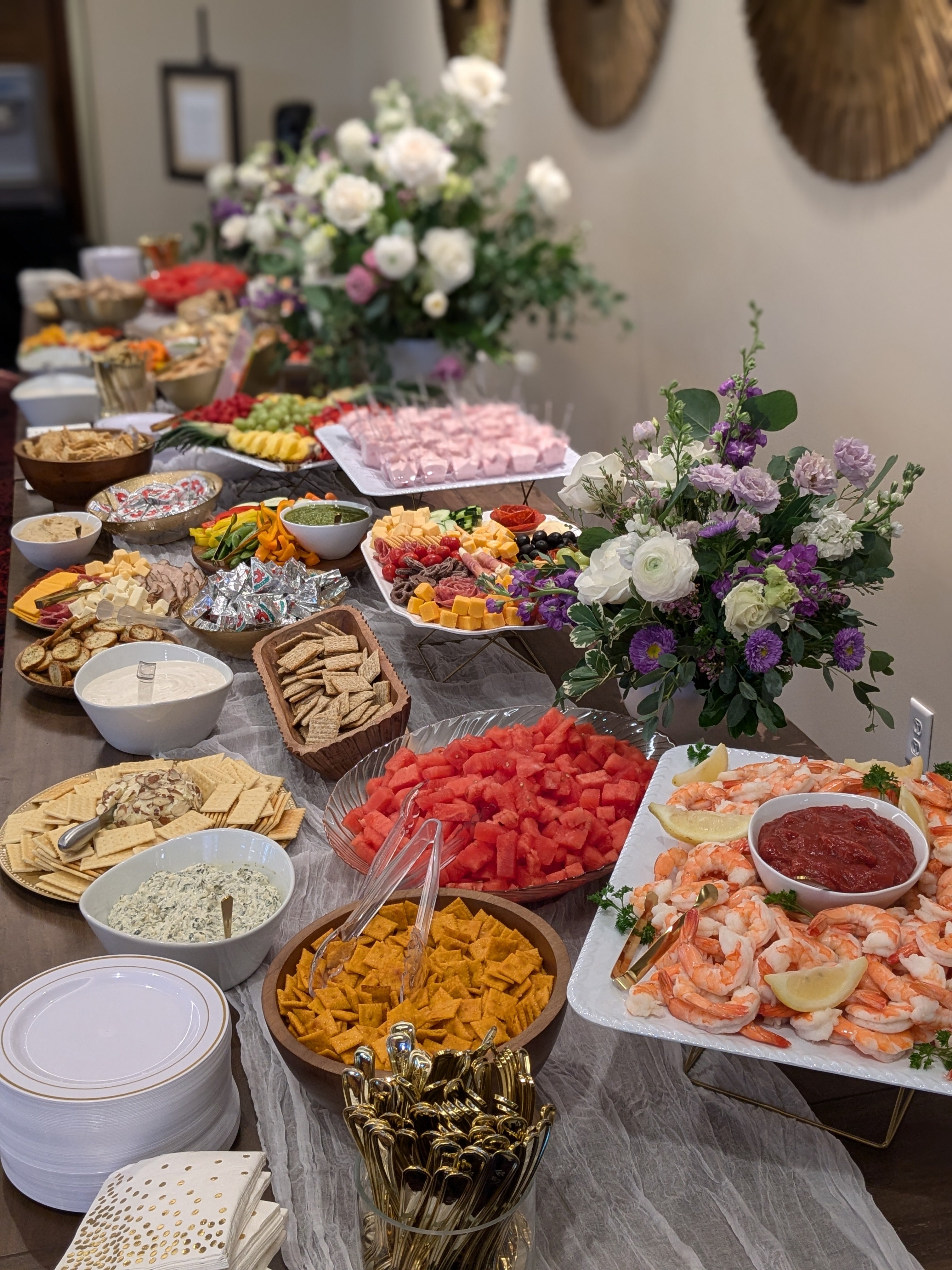 Charcuterie, Meat, Cheese, Fresh Fruit, Shrimp, Crackers, Large table display, Food Covering the full table.  